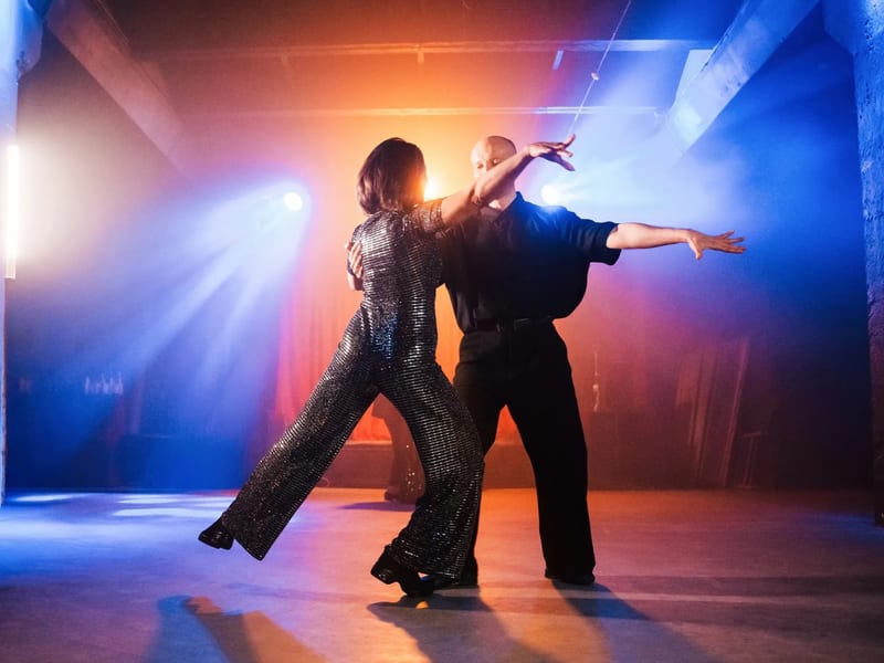 Instructor teaching a ballroom dance lesson